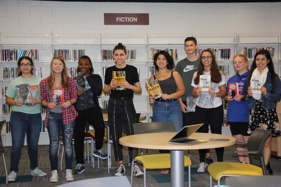 Members+of+Book+Club+hold+their+novels+of+choice.+Book+Club+meets+every+Thursday+in+the+Media+Center.