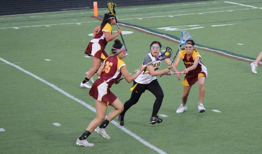 Savannah+Williams+and+Diana+Bobadilla+fight+for+the+ball+in+a+lacrosse+game+versus+Fremd.