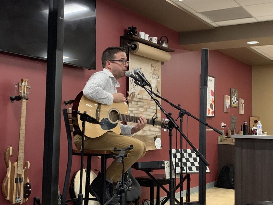 Mr. Elwell performs a song at the first Open Mic Night on September 4 in Siegies Corner. 