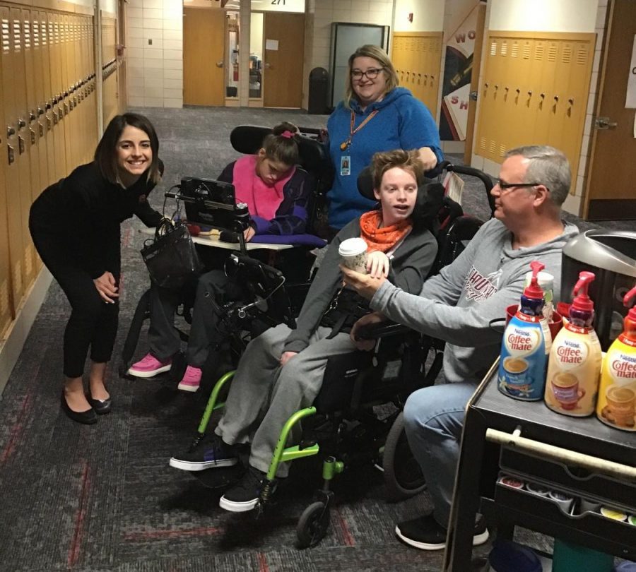 Drew Beck and Monica Moreno sell coffee to Ms. Bingham.