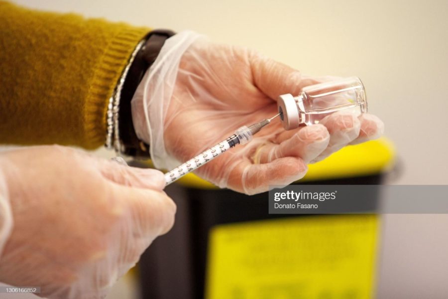 A nurse takes the vaccine from the bottle on March 09, 2021 (Photo by Donato Fasano/Getty Images)