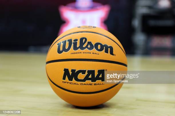 KANSAS CITY, MO - MARCH 10: A view of a NCAA logo on a basketball with the Big 12 logo in the background before a Big 12 Tournament semifinal basketball game between the Iowa State Cyclones and Kansas Jayhawks on March 10, 2023 at T-Mobile Center in Kansas City, MO. (Photo by Scott Winters/Icon Sportswire via Getty Images)