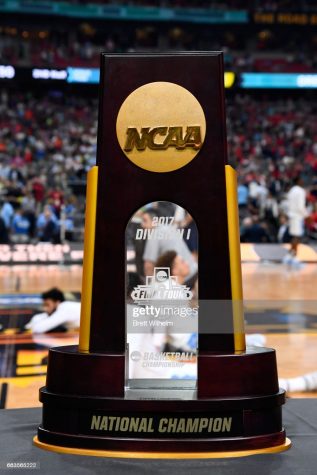 GLENDALE, AZ - APRIL 01: The NCAA Photos via Getty Images National Championship trophy sits on the sideline prior to tip-off against the Oregon Ducks and the North Carolina Tar Heels  during the 2017 NCAA Photos via Getty Images Mens Final Four Semifinal at University of Phoenix Stadium on April 1, 2017 in Glendale, Arizona.  (Photo by Brett Wilhelm/NCAA Photos via Getty Images)