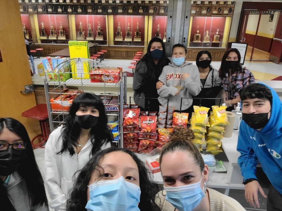 Members of Latinos Unidos stop for a selfie during concessions at an SHS basketball game. 