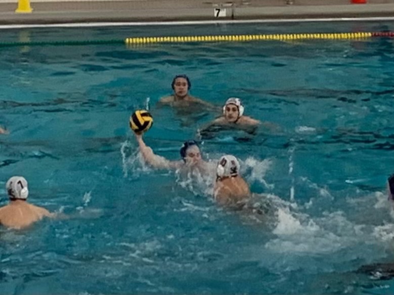 The SHS water polo team plays defense in their game against Prospect.