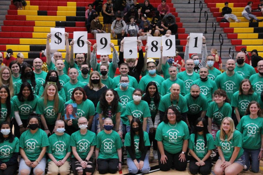 St. Baldricks participants and organizers proudly display the nearly $70,000 in fundraising.