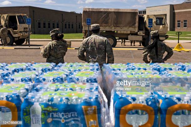JACKSON, MS - SEPTEMBER 01: Members of the Mississippi National Guard hand out bottled water at Thomas Cardozo Middle School in response to the water crisis on September 01, 2022 in Jackson, Mississippi. Jackson has been experiencing days without reliable water service after river flooding caused the main treatment facility to fail. (Photo by Brad Vest/Getty Images)