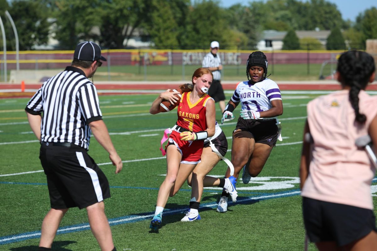 Mia Phelps elude tacklers in a Saxons early season victory