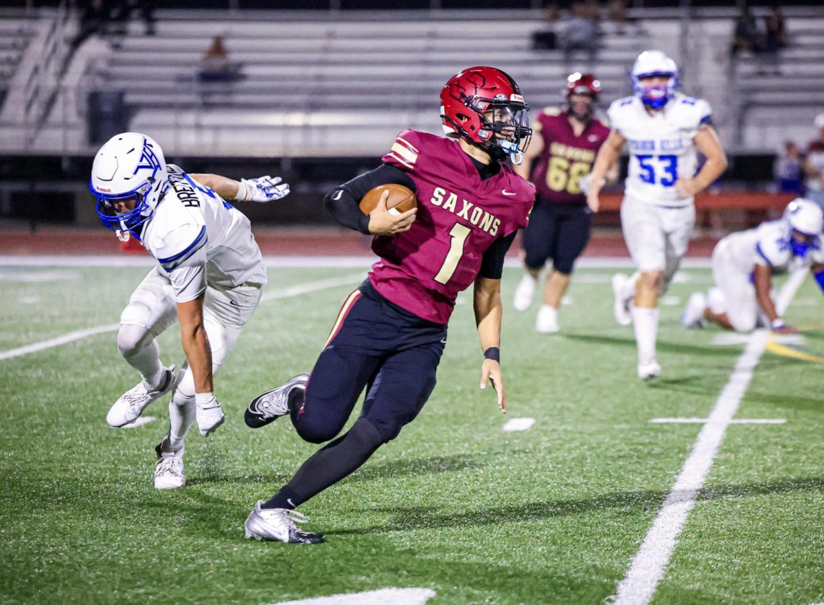 Senior Ray Black alludes a defender in the Saxons' 49-7 victory. 