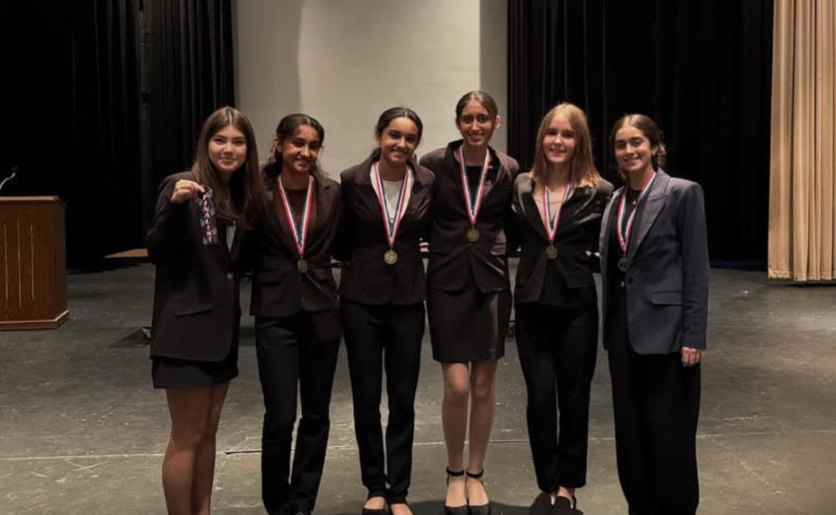 Mia Jacobsom, Sanchi Patel, Savya Patel, Gurmaan Kaler, Julia Strojny, Eseem Komal display medals at the SHS Turkey Tournament. 