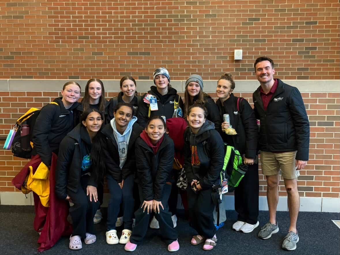 SHS swimmers stop to take a group photo.