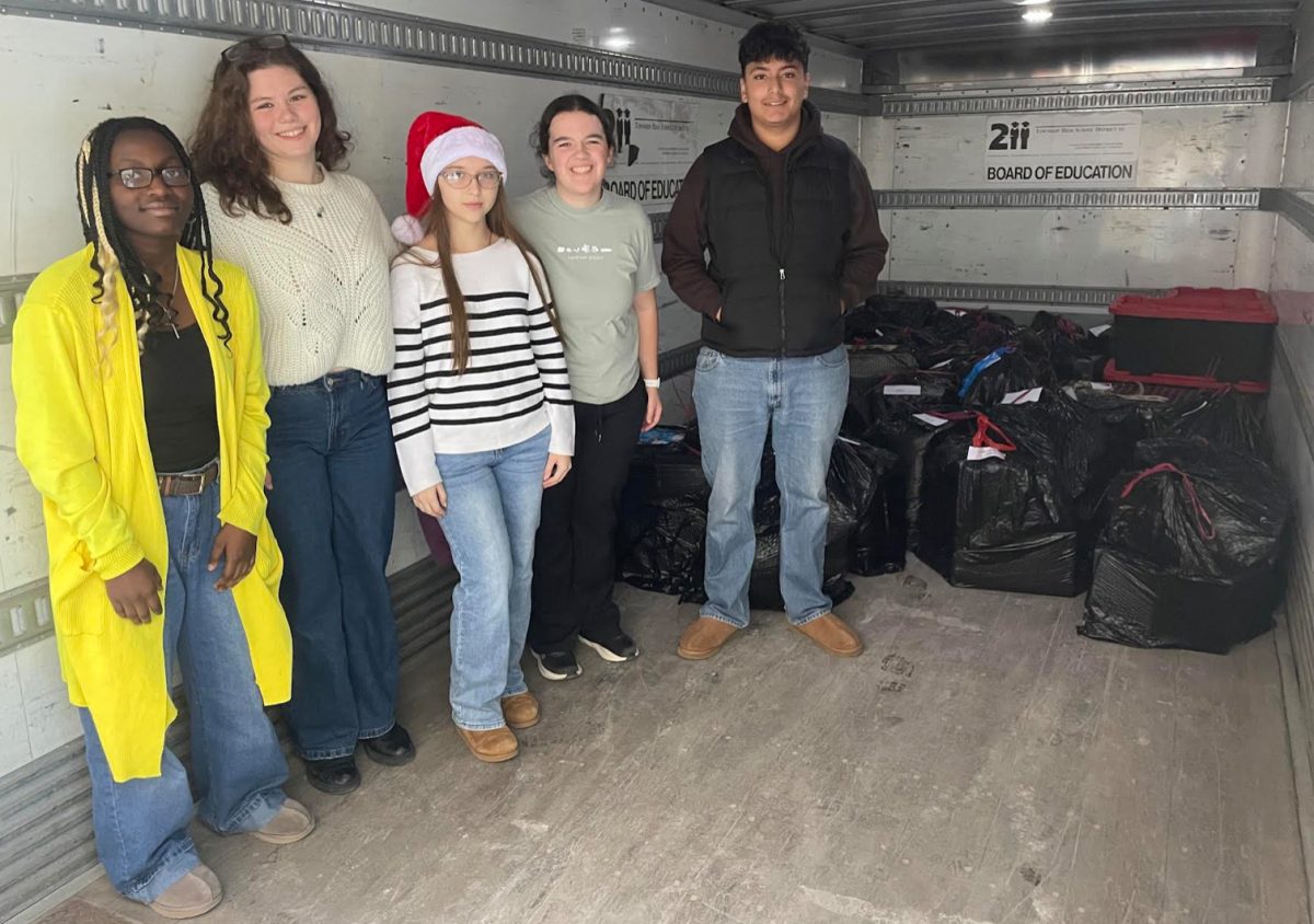 Students help with Adopt-a-Family donations 